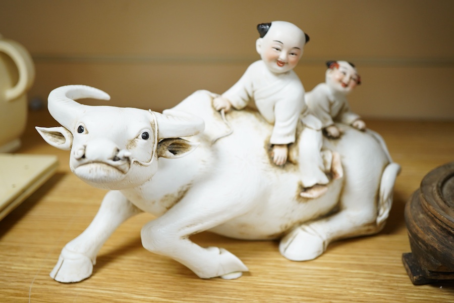 A Chinese Shiwan pottery pod shaped 'frog' vase - 32cm high including stand and a biscuit buffalo group (2)